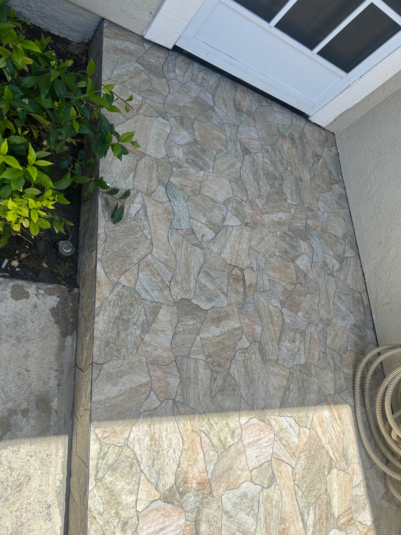 Close-up of flagstone-look porcelain tile at front entrance