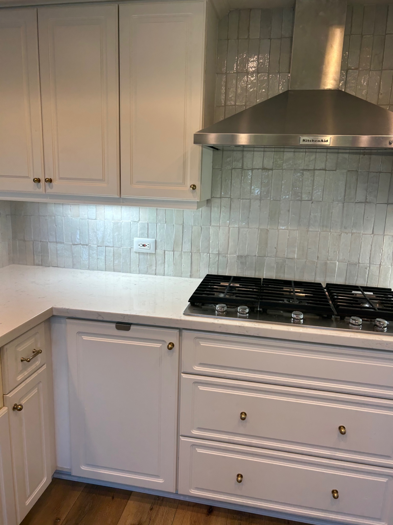 Zellige backsplash detail behind KitchenAid range hood