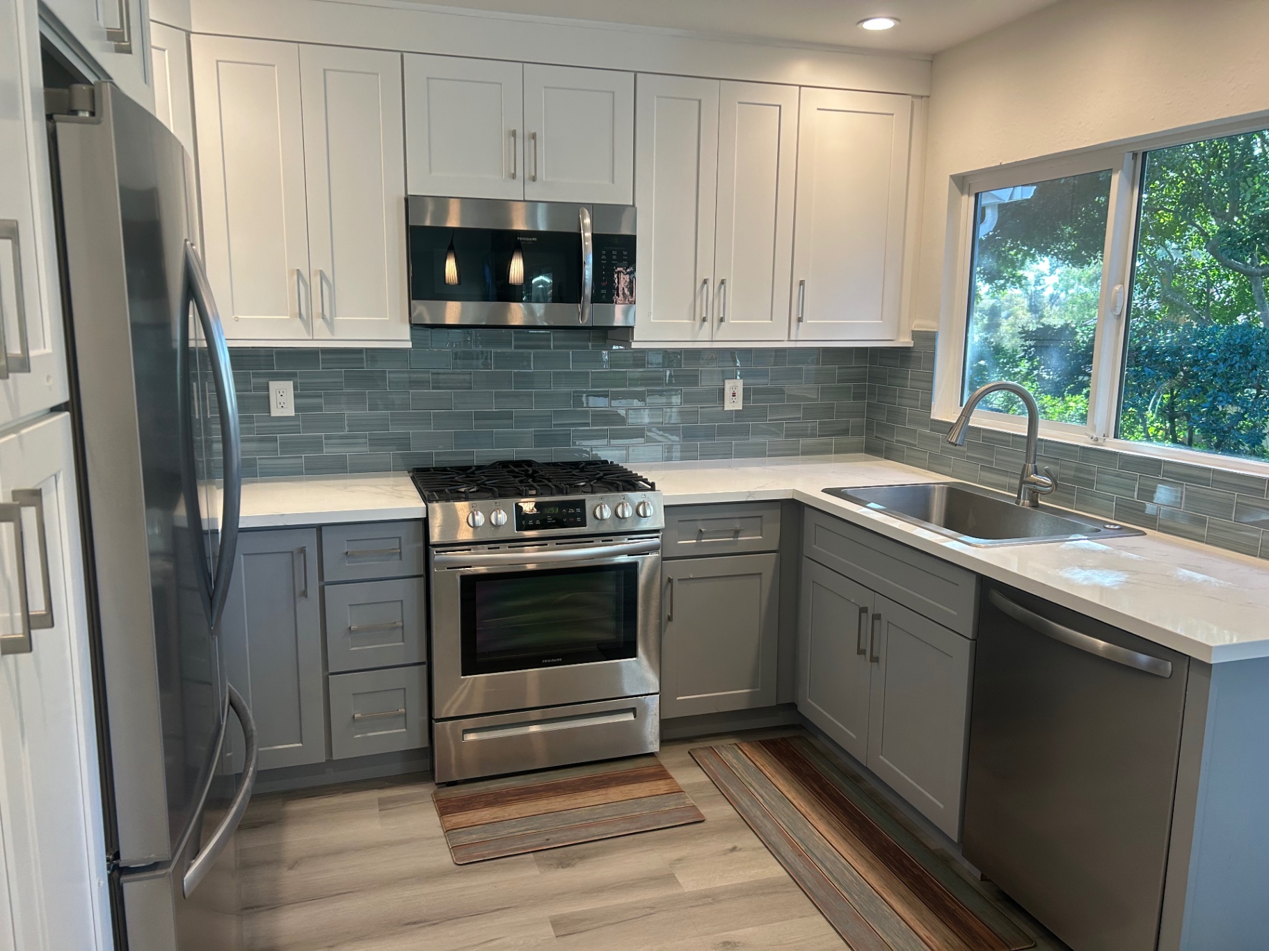 Gray glass tile kitchen backsplash