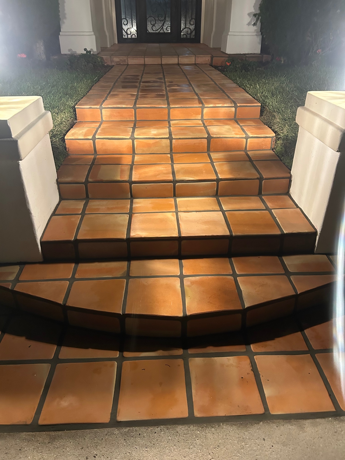 Outdoor terracotta tile front entrance and steps